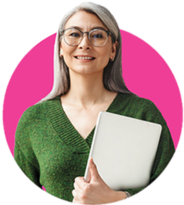 Smiling retiree holding a laptop against their chest with one arm