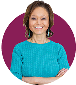 Smiling retiree with arms crossed in front of their body