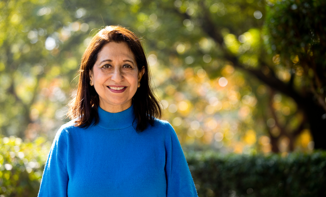 smiling older women standing outside on a sunny day