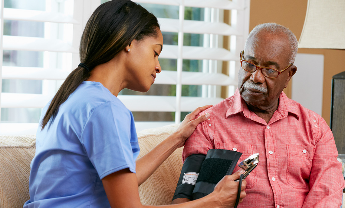 Nurse visiting patient at home