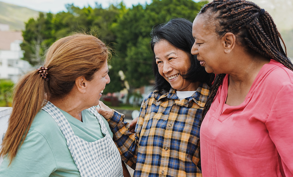 older adults together outside at a volunteer event